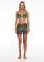 Rozal Active model demonstrating how to measure for bra size – wearing moss green PowerFlex sports bra, women’s activewear size guide.