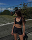 Rozal Active Nero PowerFlex Low Cut Bra and High Waist Shorts – sleek, breathable activewear for performance and style on tennis court.